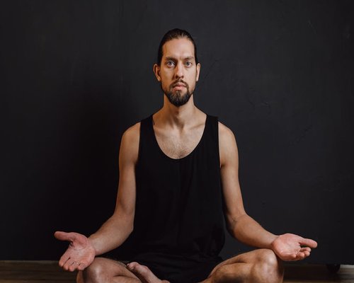 Person practicing meditation for stress relief